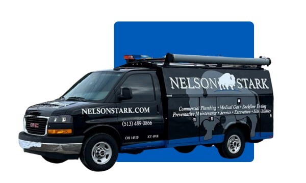 Construction van in front of blue square